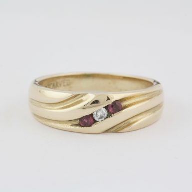 Pre-Owned 14 Karat Yellow Gold Diamond and Ruby Wedding Band